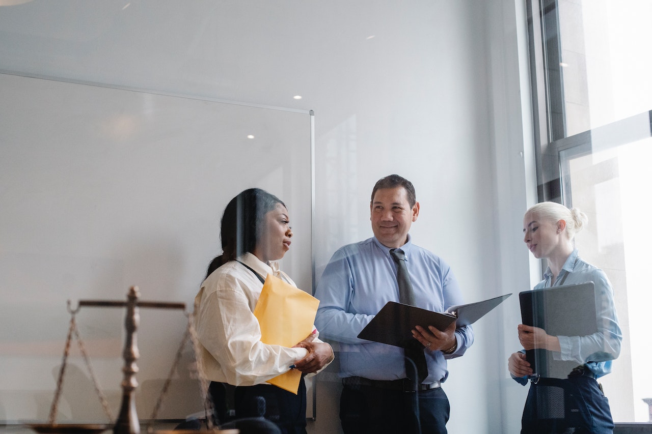 Professional holding documents while talking