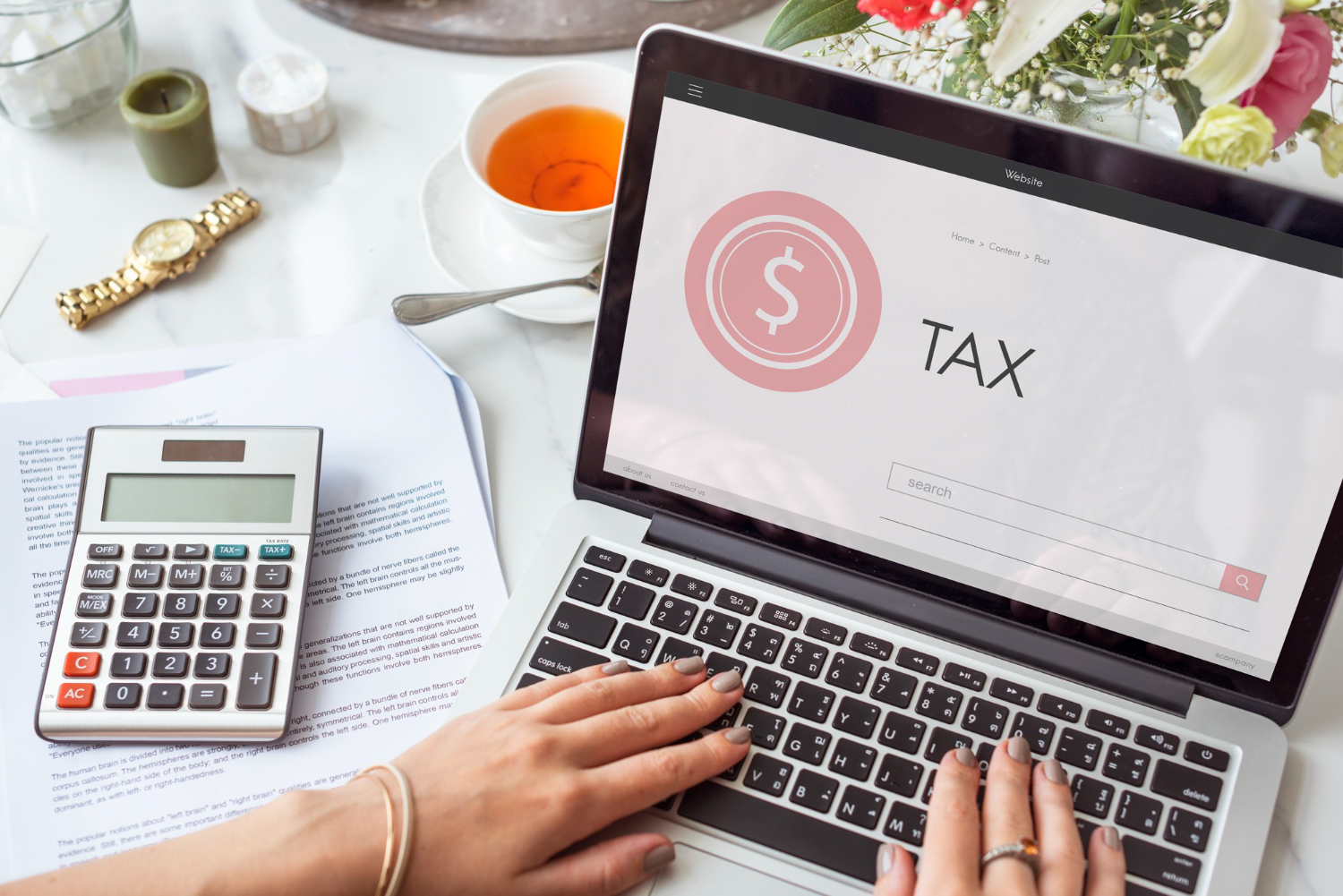 A business person using his laptop to pay for tax