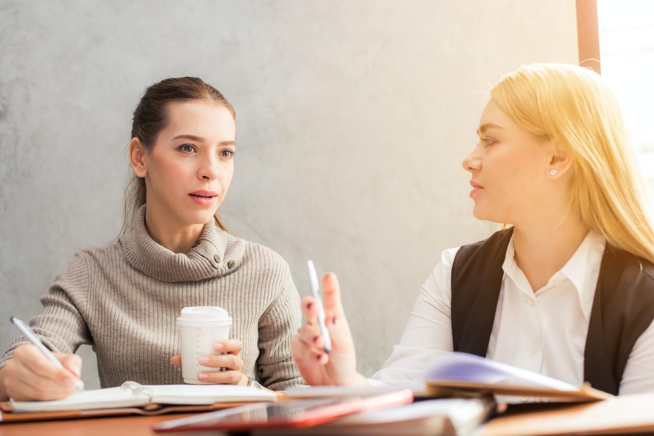 Two-work-colleagues-having-a-work-conversation