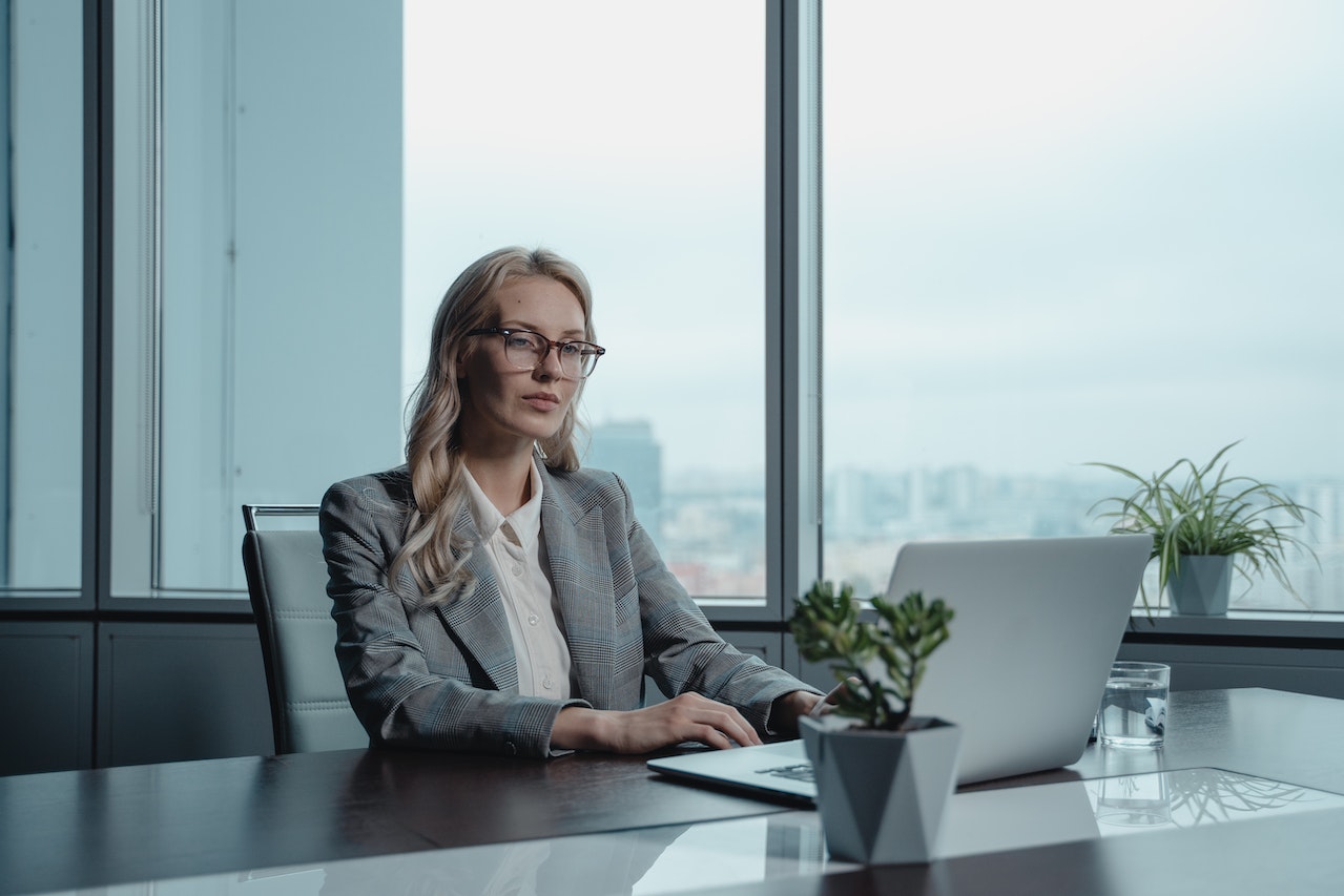 Woman Sitting by the Table Working