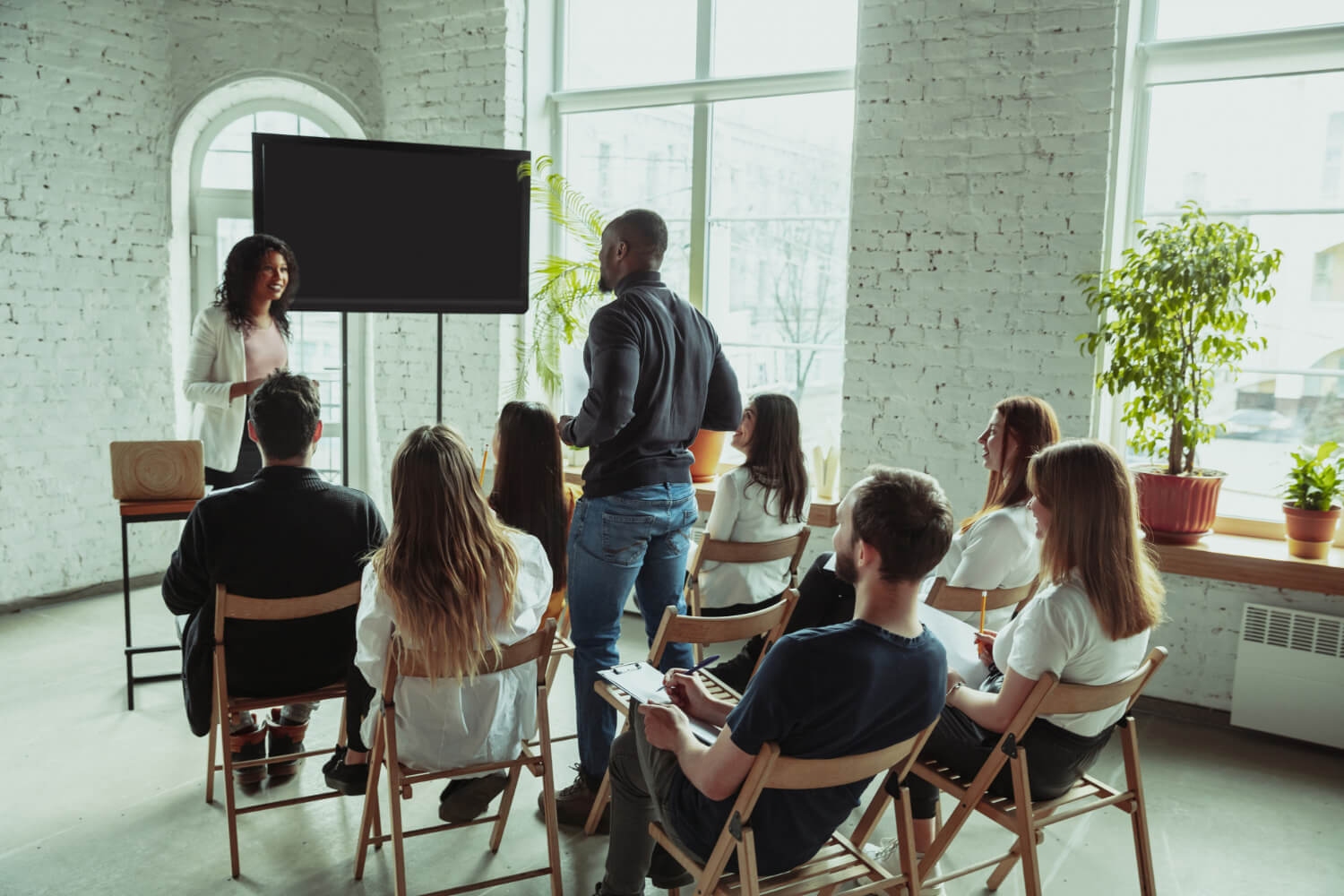 Young female coaching a group of people