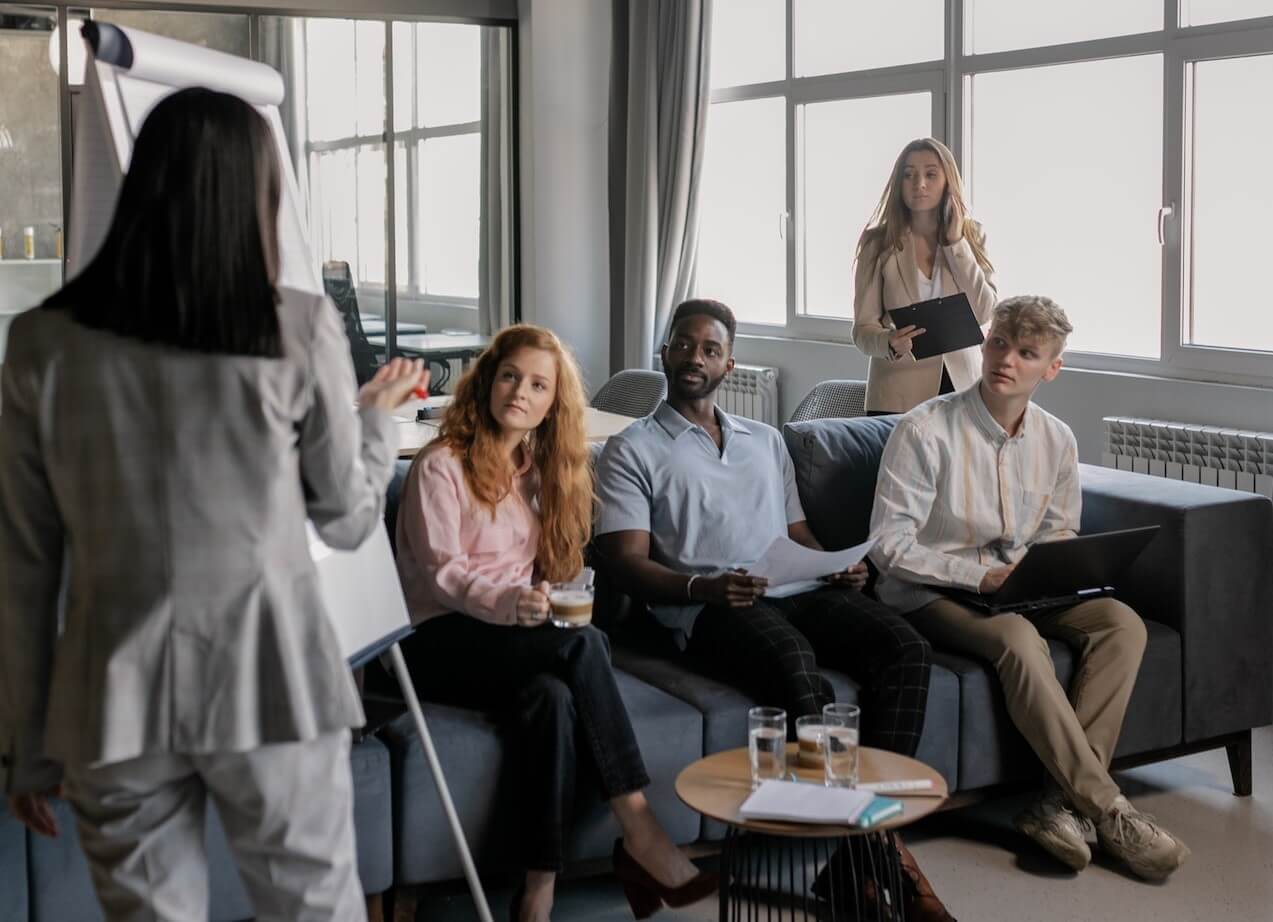 Young woman coaching a group of people