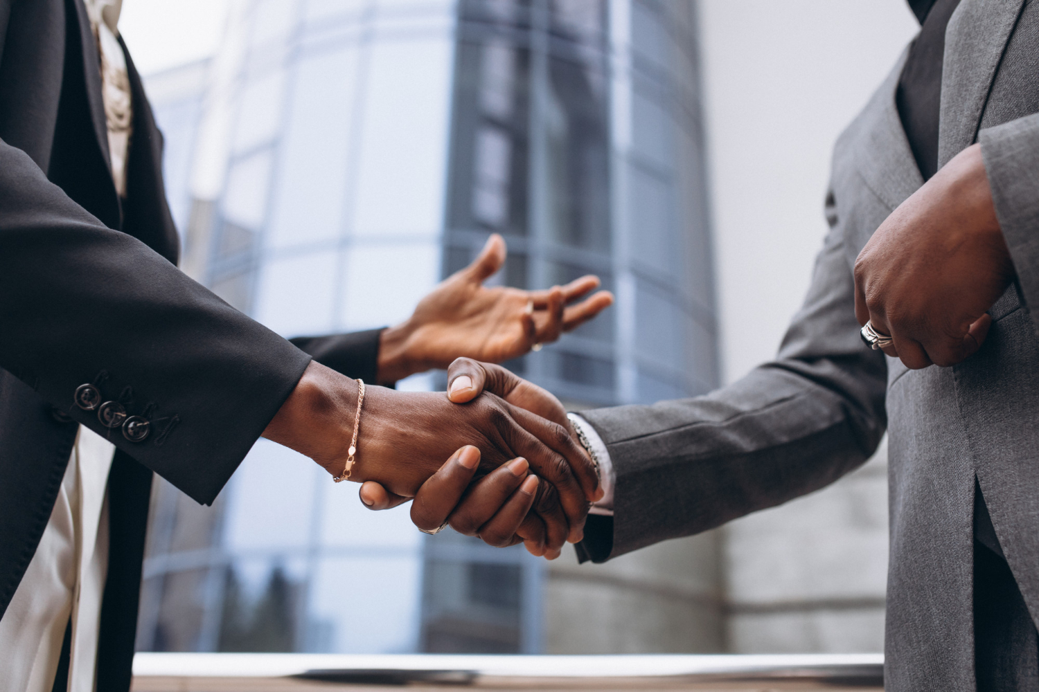 two persons shaking hands as a sign of goodwill