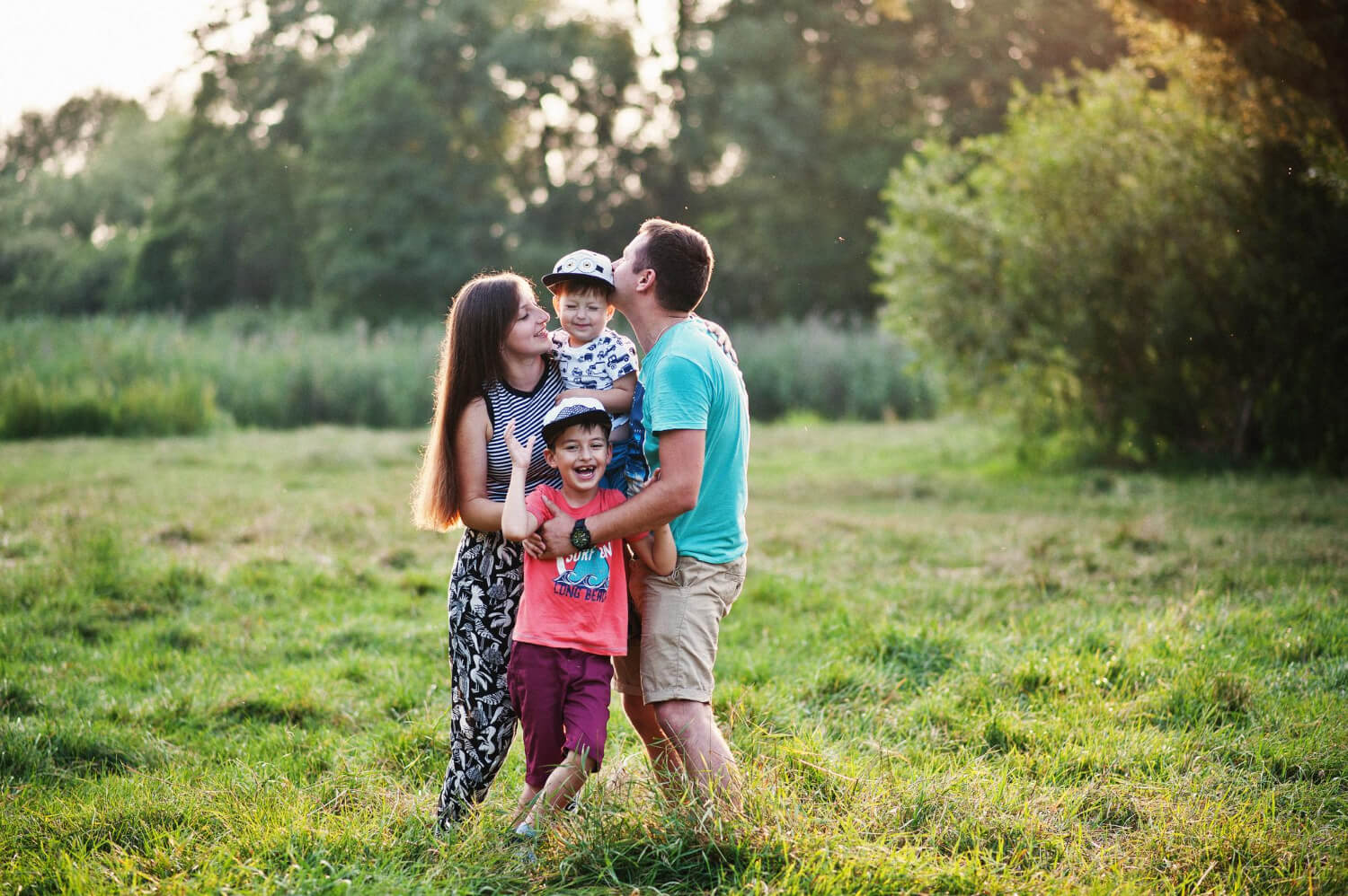 happy-young-family-mother-father-two-children-son-nature-having-fun.