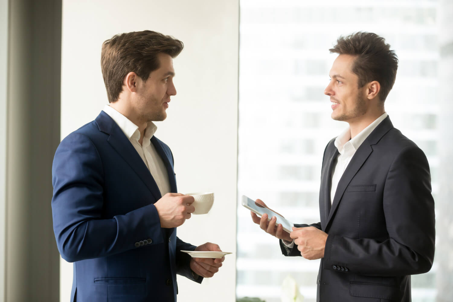 two-successful-businessmen-discussing-business