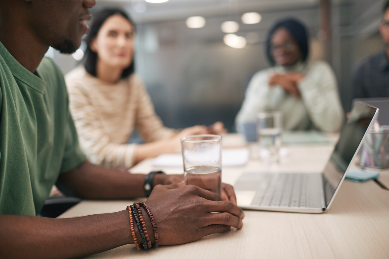 A Group of People Having a Meeting in the Office