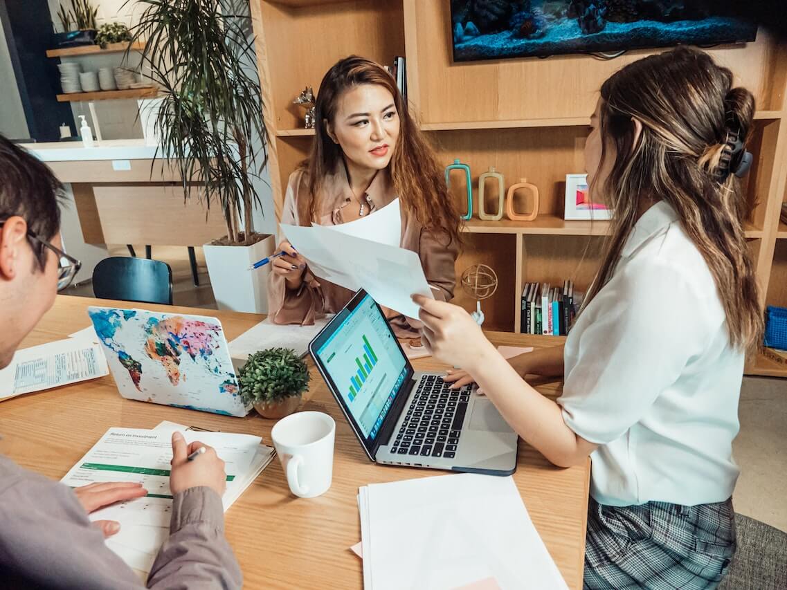 A Group of People Having a Meeting in the Office