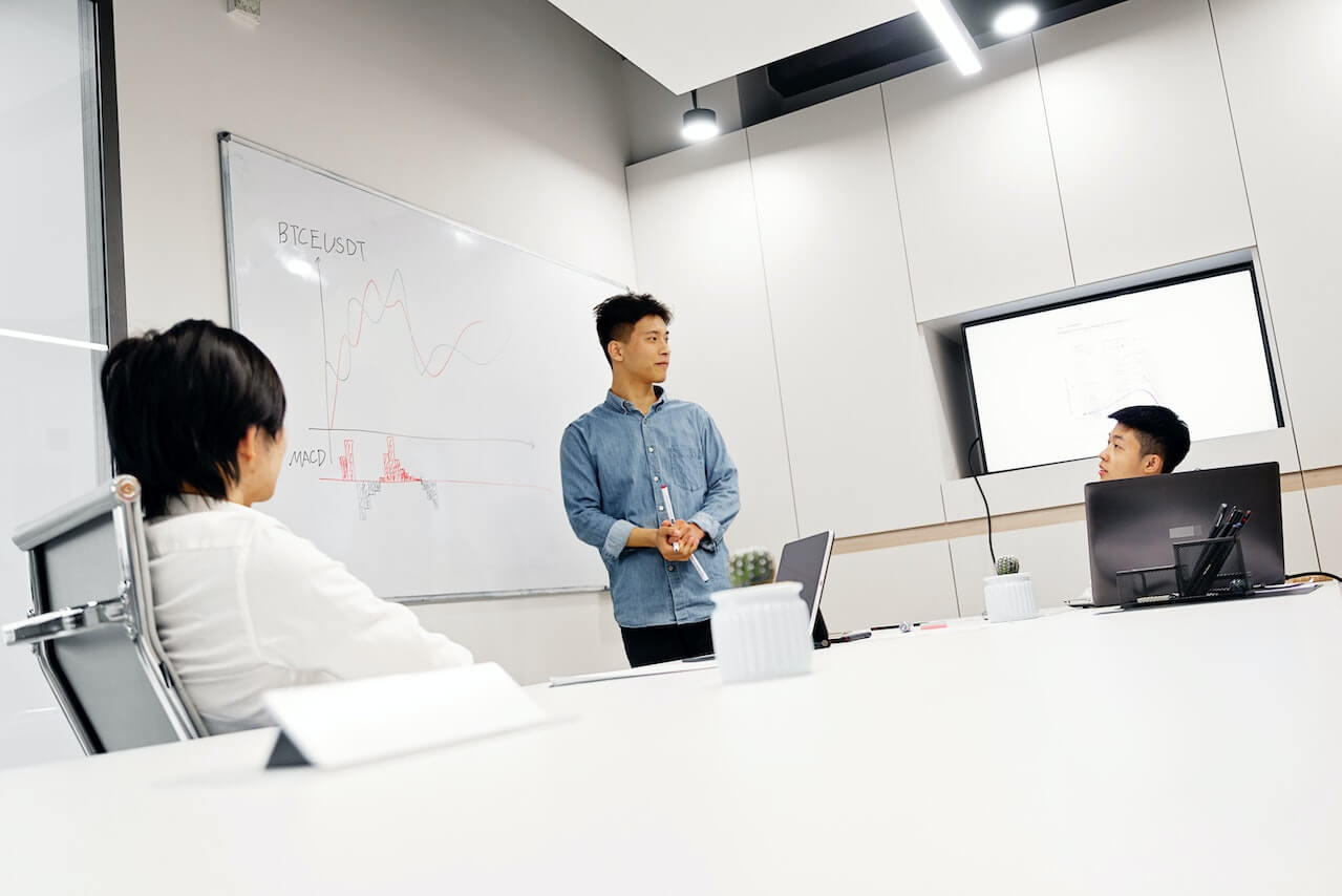 A man presenting in a business meeting