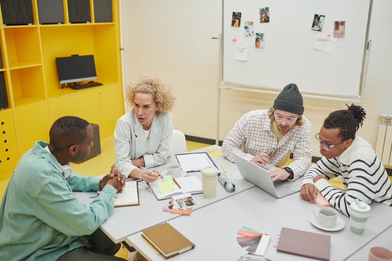 A Team Having a Meeting at the Office