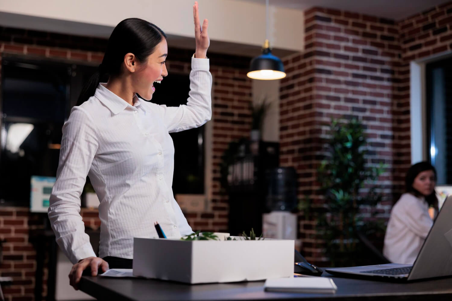 A-businesswoman-unpacking-her-belongings-after-being-called-back-to-work