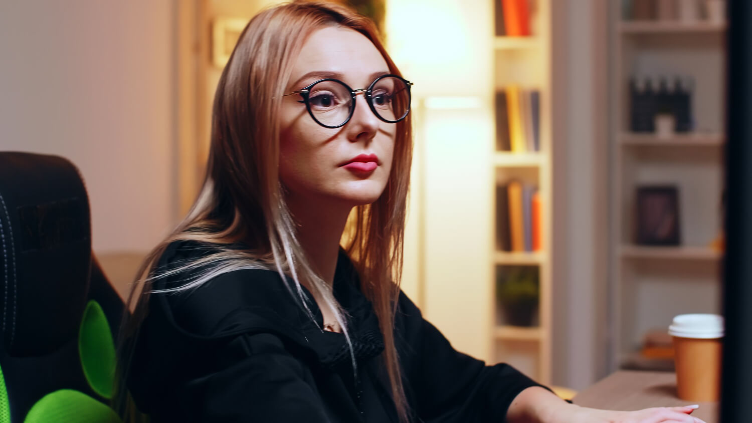 A focus, purposeful young female in an office