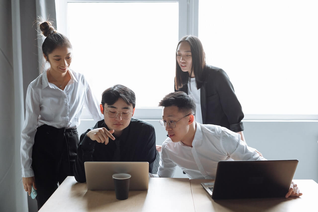 A Group of People Having a Meeting in the Office