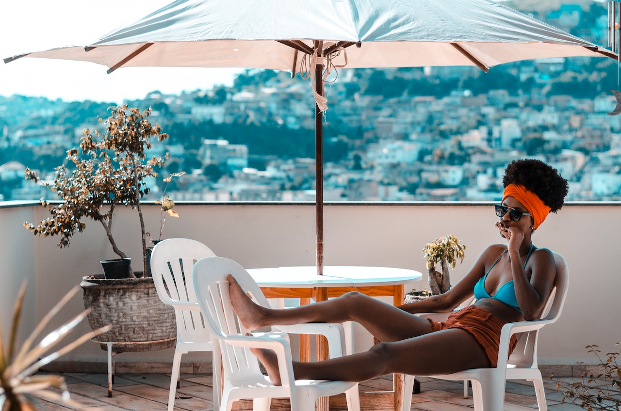 A-woman-enjoying-a-vacation-time-in-a-beach-house