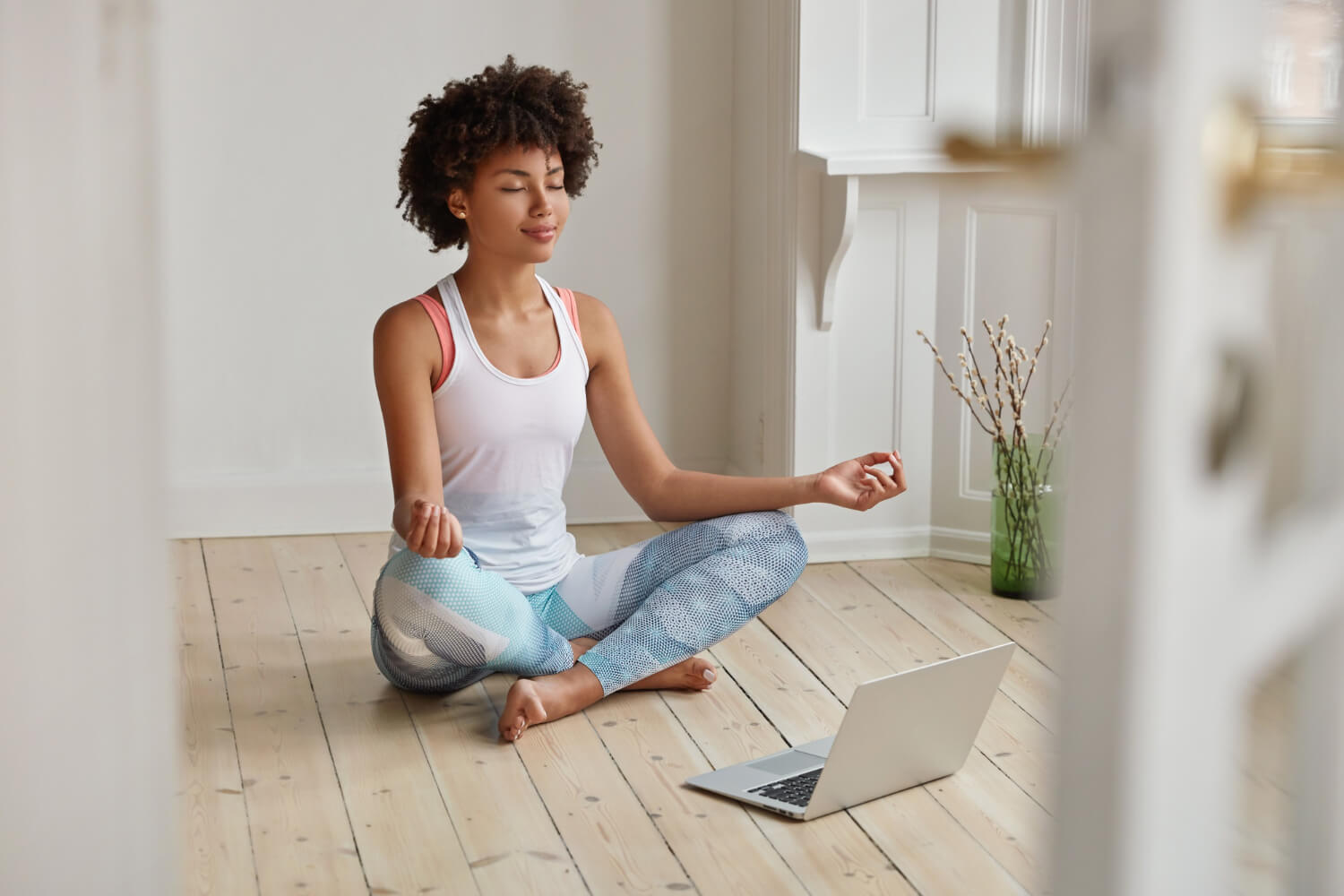 A-young-woman-relaxed-and-meditating-in-her-room