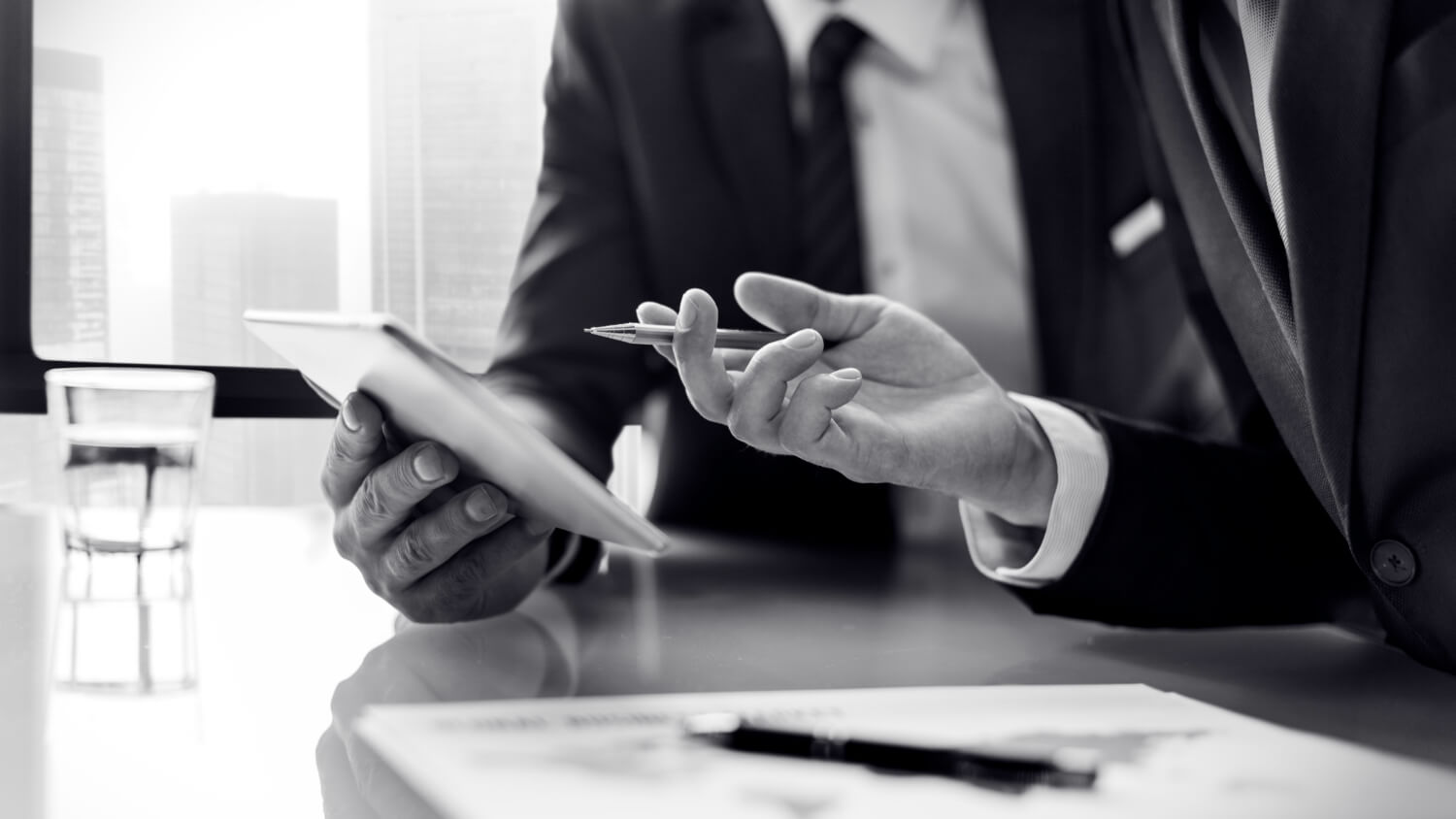 Business people looking at a tablet screen