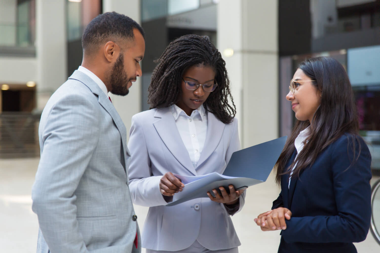 Business people looking a document discussing