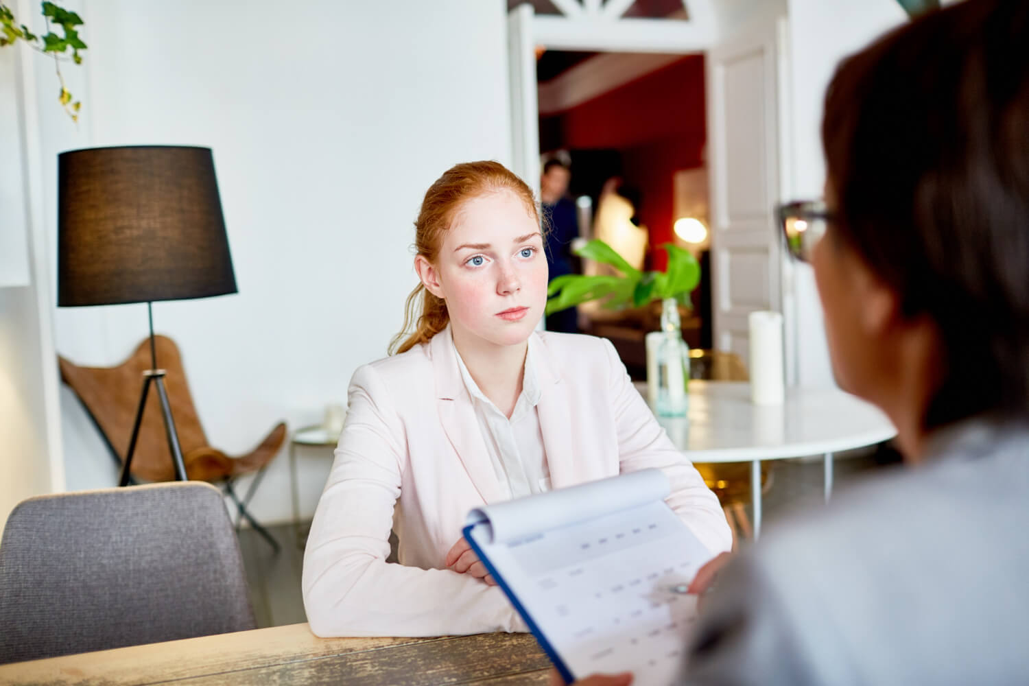 Business woman holding a note conducting an interview