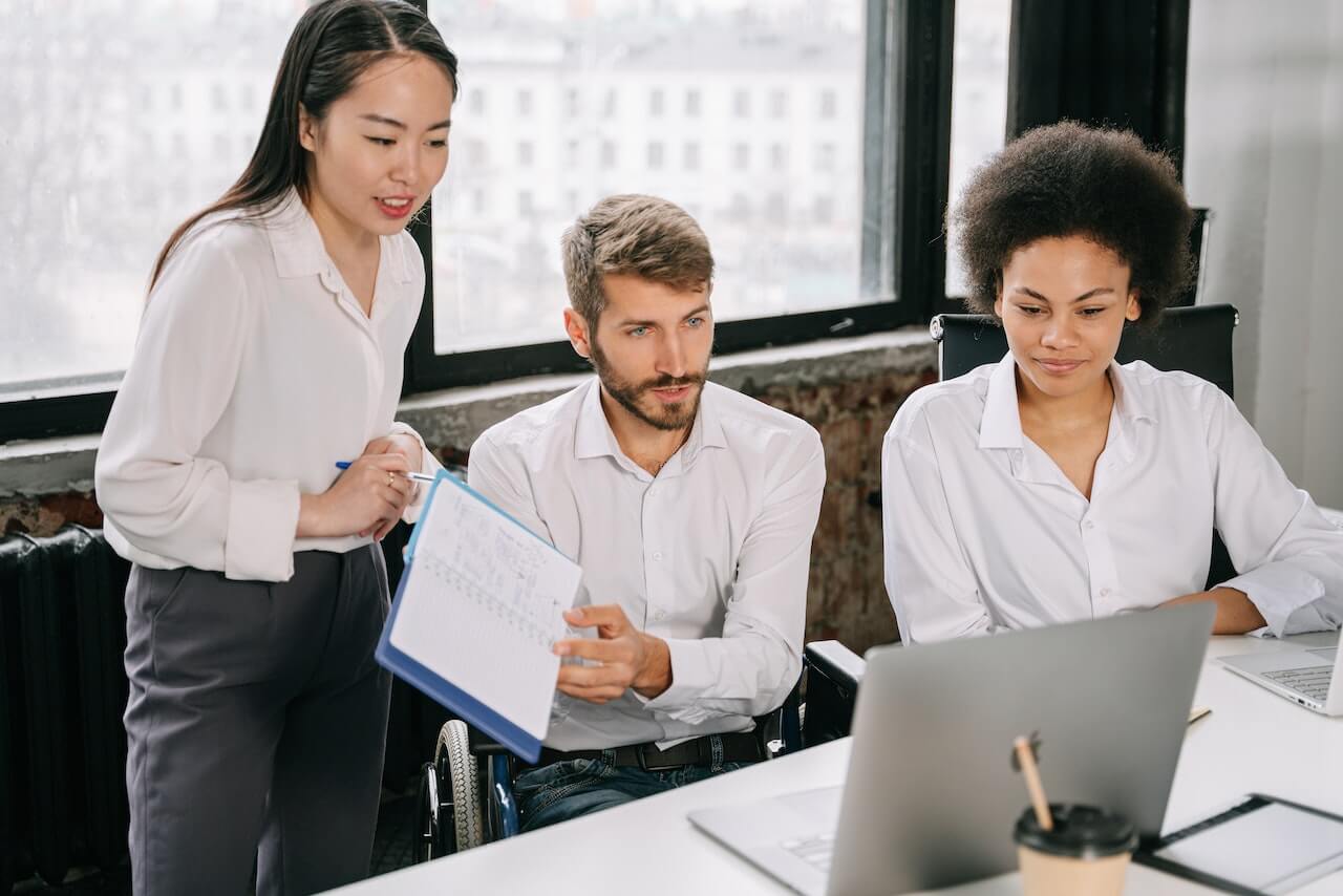 Group Presenting in Front of the Laptop