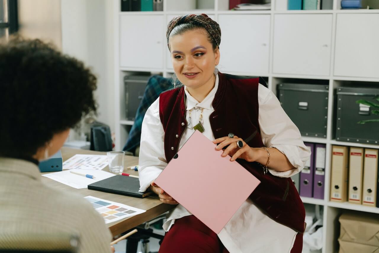 Woman talking to her Colleague