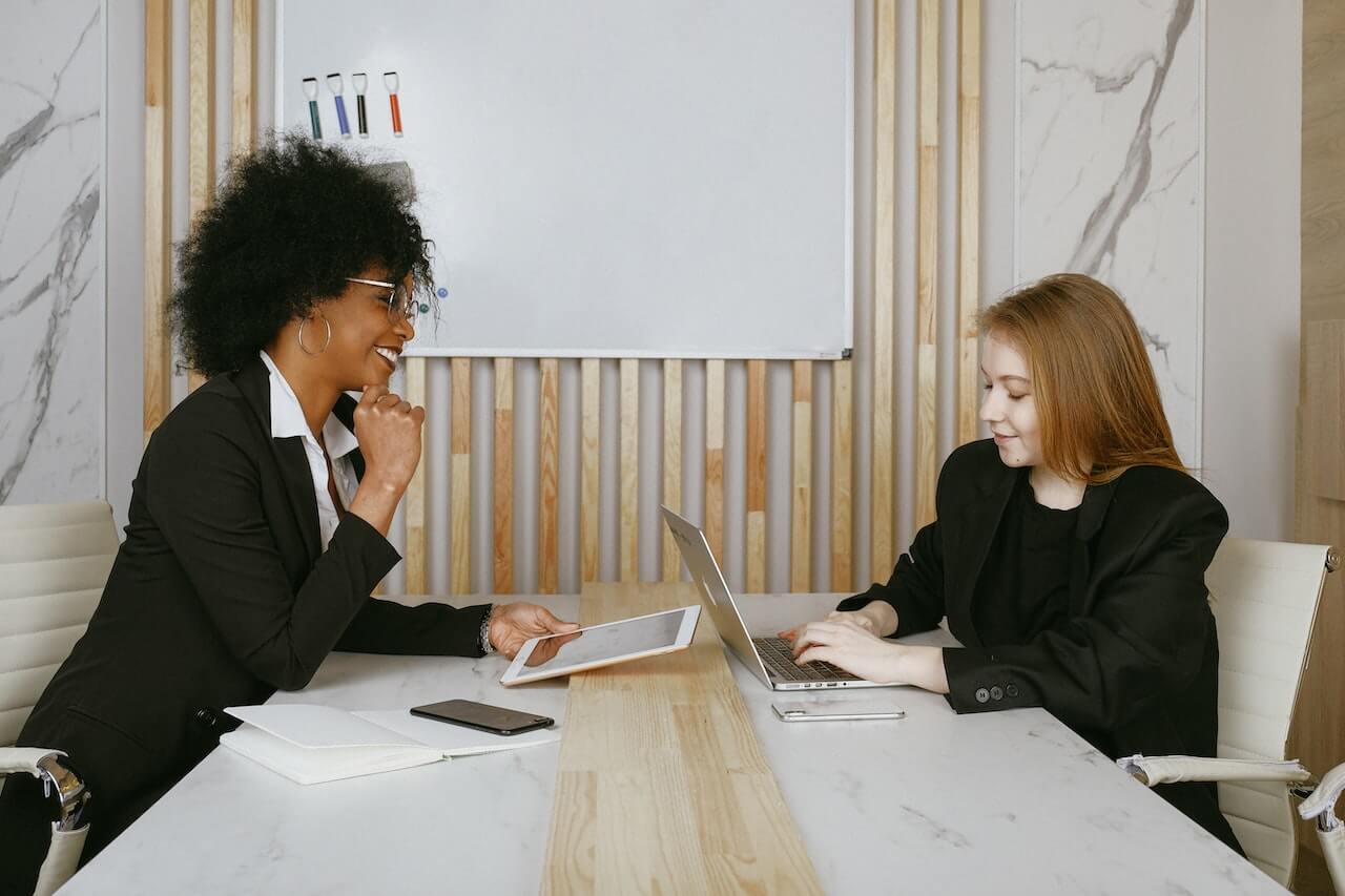 Women on suits working in the office