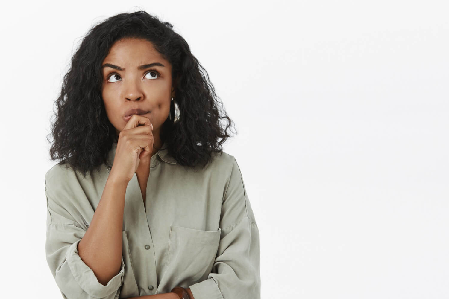 Young lady thinking-standing-focused on a thoughtful-pose