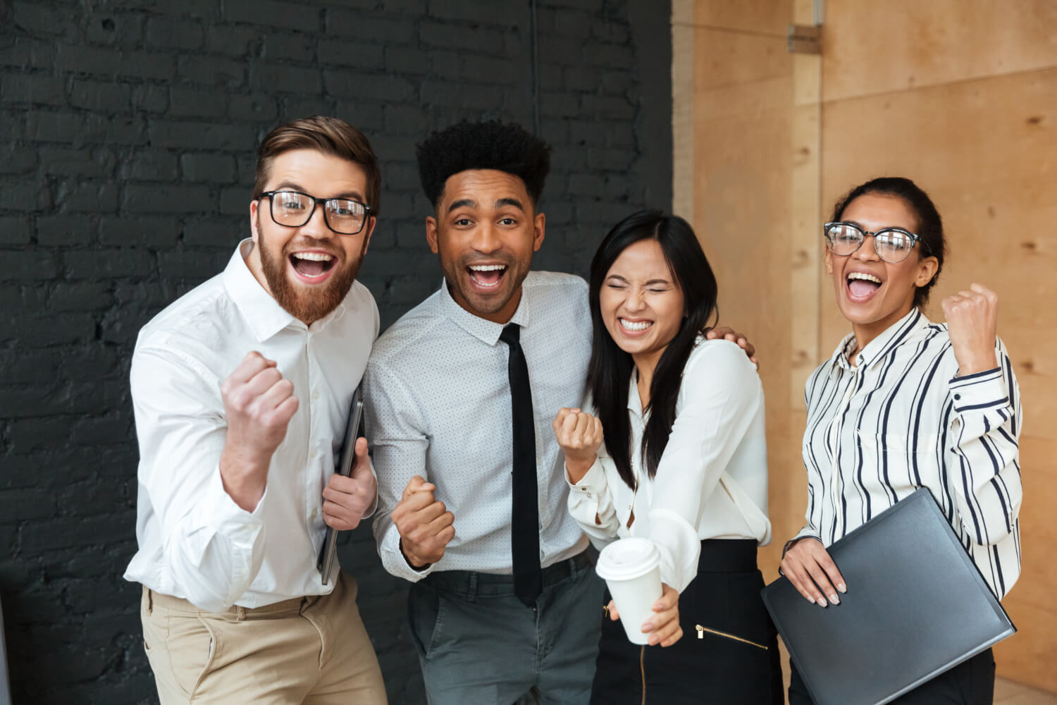 happy-excited-young-business-colleagues-make-winner-gesture