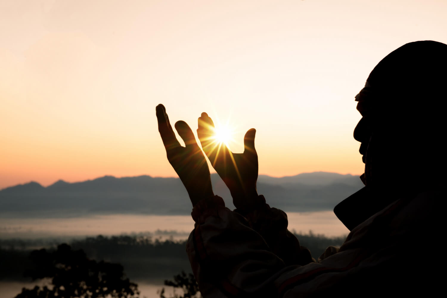 Man with palms open while he meditates