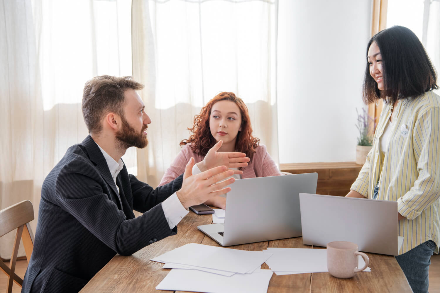 people-having-debate-while-looking-computer