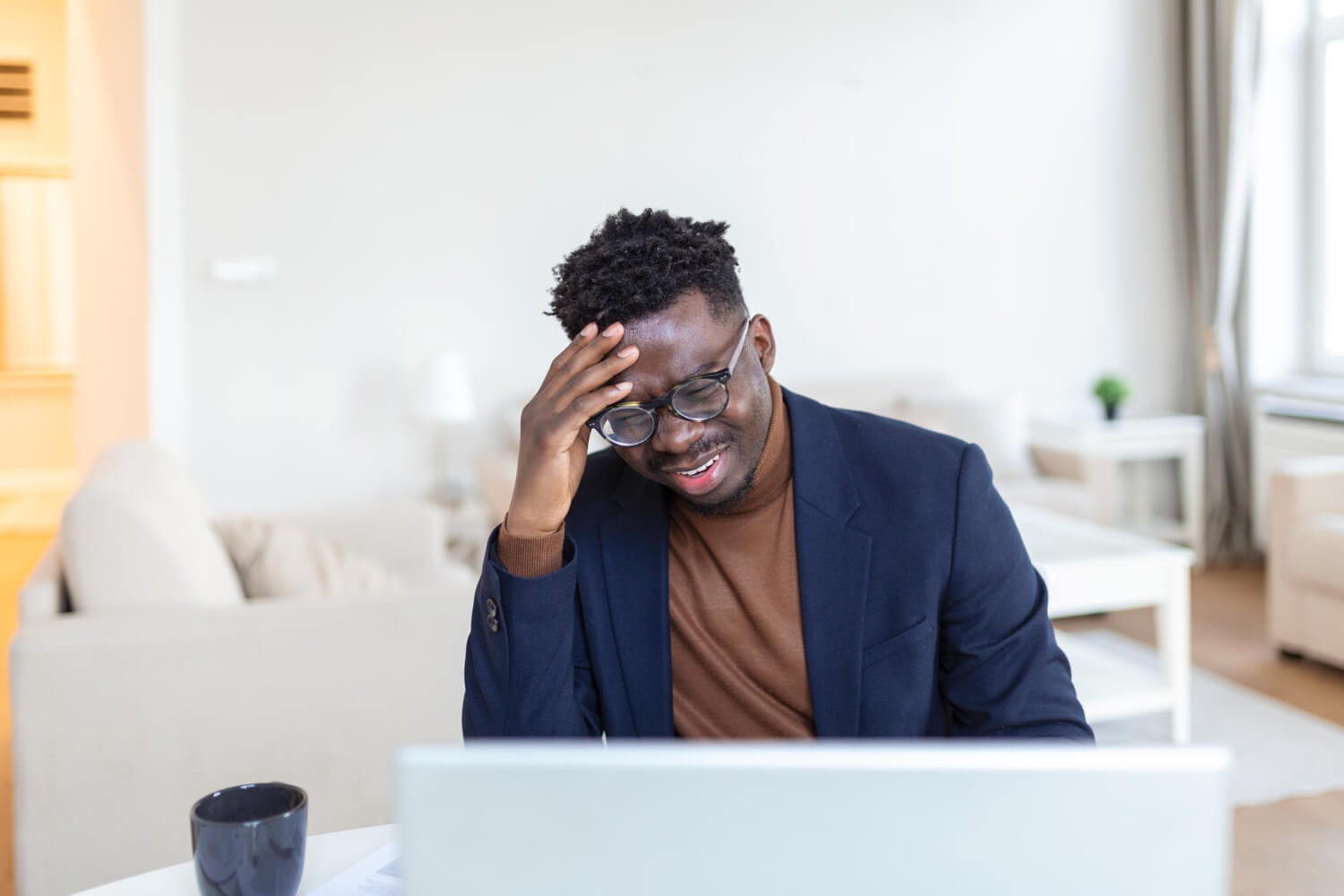 stressed-tired-african-american-man-touching-temples-suffering-from-headache-after-long-hours-work-