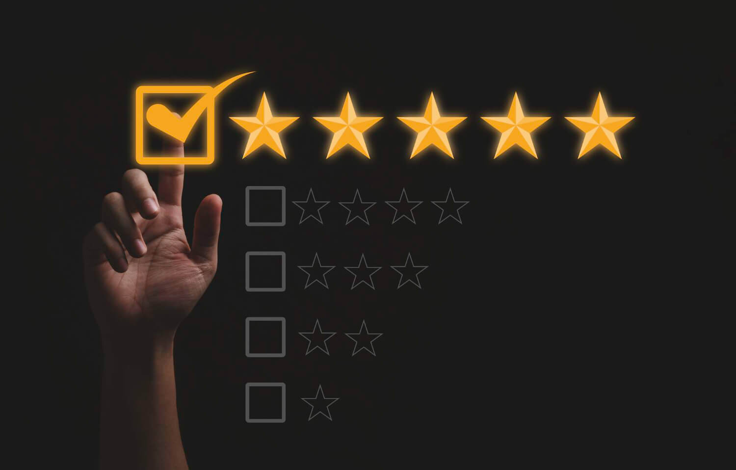 Hand ticking the 5 yellow stars options on black background for an online review