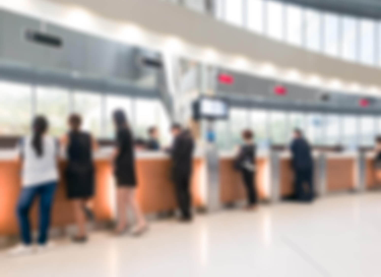 Bank customers making transactions at the bank counter in a banking hall