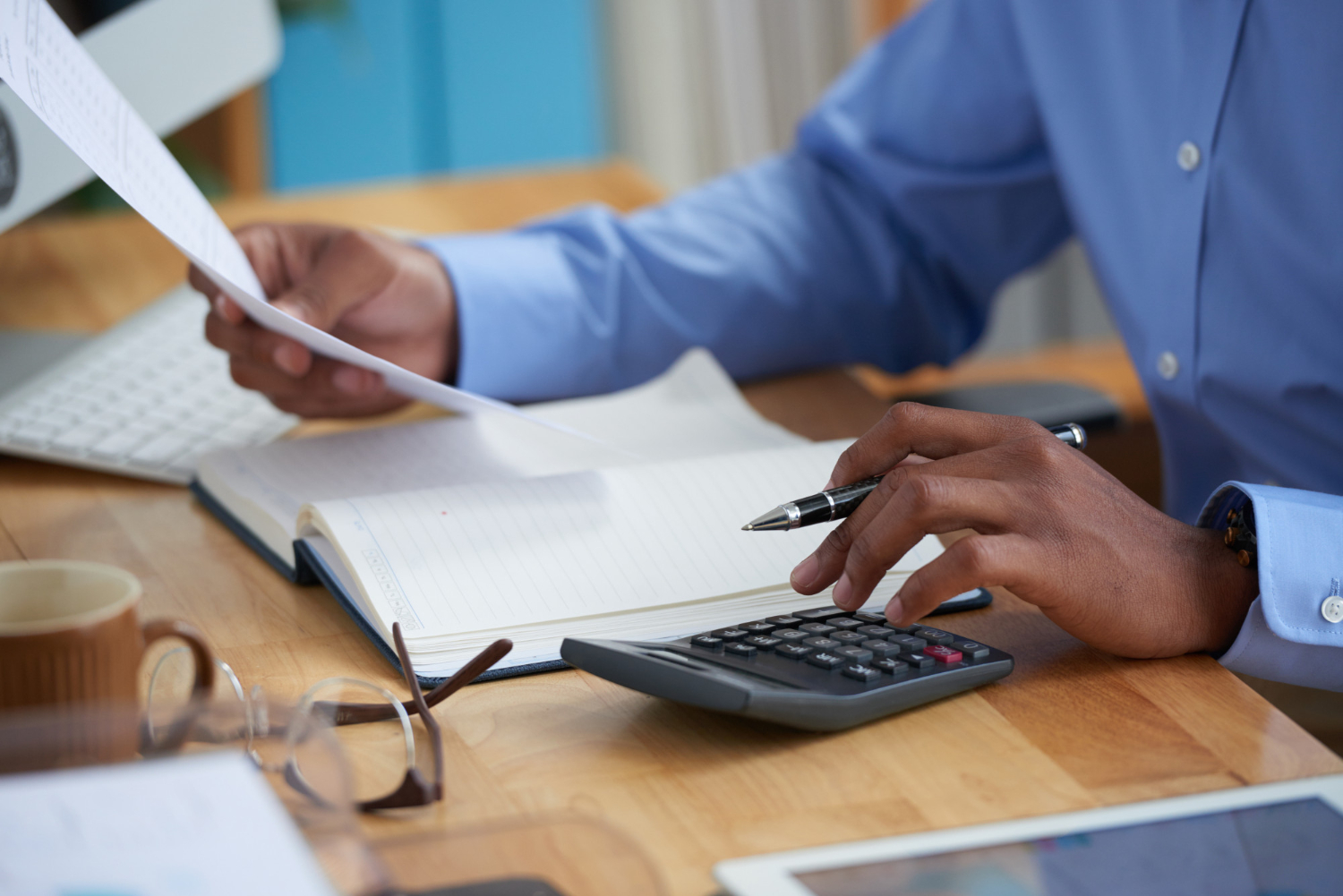 Businessman sorting through company's financials