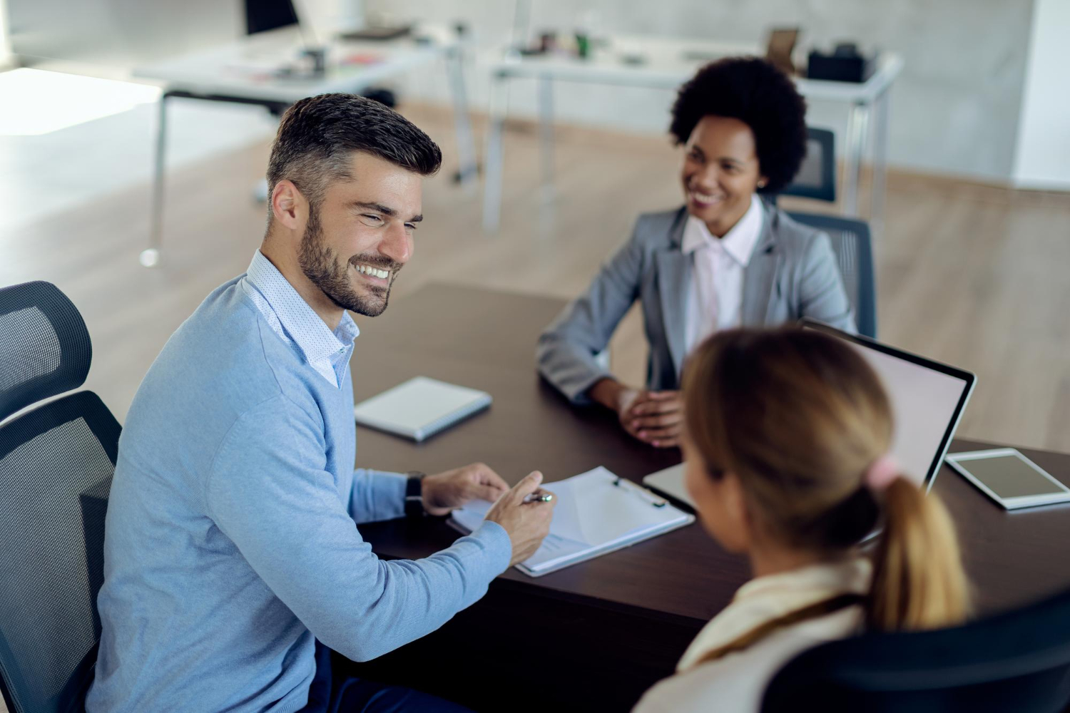 3 Business professional discussing a contract