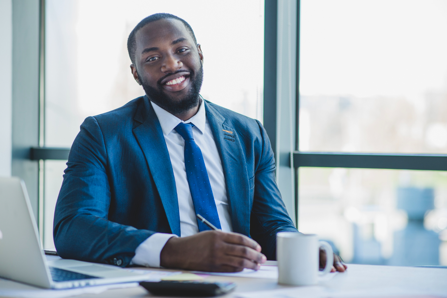 bank manager smiling in his office