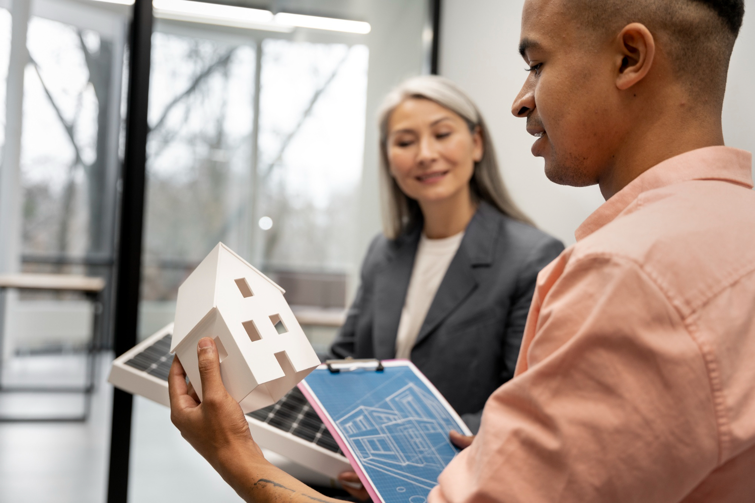 Rental management agent discussing with an energy professional